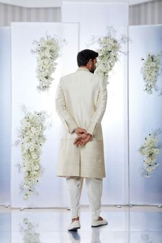 This cream sherwani set features all over gold zari embroidery on a raw silk base. It is paired with a cotton silk kurta and dhoti pants. Completing embroidered stole and footwear is also available.From Seema Gujral's Tuscan Summer collection. DELIVERY TIMEPlease allow 8-12 weeks for your outfit to arrive.FABRIC DETAILSRaw SilkProfessional cleaning only. Gold Sherwani, Cream Sherwani, Tuscan Summer, Ridhi Mehra, Anushree Reddy, Zari Embroidery, Dhoti Pants, Silk Kurta, Tarun Tahiliani