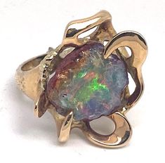 "Lady's vintage opal and yellow gold freeform ring. Beautiful ring with a free form black opal set in the center of an abstract design. This piece weighs approximately 14.0 grams, is stamped \"14K\", and ring size is approximately 9. It is in good condition and would make a beautiful addition to your vintage jewelry collection." Freeform Ring, The Witcher Geralt, Beautiful Ring, Black Opal, Opal Jewelry, Rings Statement, Abstract Design, Beautiful Rings, Statement Rings