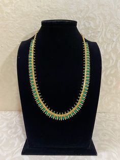 Long ad necklace. Simple design Affordable Traditional Long Necklace, Green Single Strand Long Necklace, Green Single Strand Long Beaded Necklace, Traditional Hand-strung Long Necklace, Traditional Green Long Necklace, Indian Jewelry, Simple Designs, Green, Design