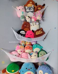 there are many stuffed animals stacked on top of each other in the shape of boats