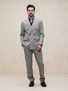 This sophisticated Italian wool suit jacket stands up to warm weather with a luxurious tropical wool fabric—a fabric beloved for its distinctive balance between an open weave and a tighter tension yarn, which gives it the ability to remain breathable while always looking pulled-together.  Tailored Slim Fit: More relaxed than our Slim Fit, this Italian cut style has a softer shoulder construction.  Fabric from Italy's Vitale Barberis Canonico.  Notch lapel with double-breasted front.  Four exterior pockets, three interior pockets.  Double back vent.  Fully lined.  Tailored Slim Fit: More relaxed than our Slim Fit, this Italian cut style has a softer shoulder construction.  Long sleeves.  Below-hip length.  Model: Size 42, 6'2" (188cm). Construction Fabric, Open Weave, Wool Suit, Wool Fabric, Italian Style, Double Breasted Suit Jacket, Hip Length, Cut And Style, First Look