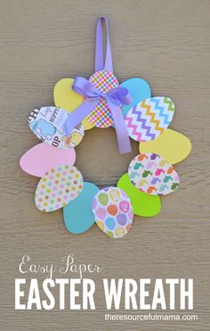 an easter wreath made out of paper with the words easy paper easter wreath on it