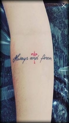 a person with a tattoo on their arm that says always and forever