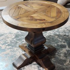 a wooden table sitting on top of a carpeted floor