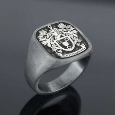 "Family Crest Signet Rings , Family Name Sign Engraved Ring , Personalized Jewelry , Custom Signet Ring Men. Beautiful piece of our Family collection. Family Rings that would you pass down as legacy from one generation to the next. This ring will be designed and tailor-made to your liking with your own custom logo. Customization: ⋆ Material : Silver ⋆ Color : Silver , Black rhodium, gold or rose gold . ⋆ Polished or matte. ⋆ Raised or Engraved. ⋆ Ring face can be 3 different dimension as your wi Classic Oval Stainless Steel Rings, Classic Adjustable Stainless Steel Signet Ring, Classic Engraved Stainless Steel Signet Ring, Anniversary Stainless Steel Open Signet Ring, Classic Stainless Steel Signet Ring As Gift, Classic Stainless Steel Signet Ring Gift, Stainless Steel Engraved Ring With Polished Finish For Promise, Stainless Steel Polished Engraved Promise Ring, Stainless Steel Engraved Ring With Polished Finish