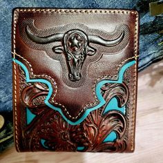 Western Genuine Leather Longhorn Logo Wallet Bifold Hand Tooled Design Floral Brown And Teal . Brand New Western Wallet Bi-Fold Style Plain Pattern On The Back Made Of Genuine Hand Tooled Leather Measures 41/2 Inches Long By 3 1/2 Inches Wide, About 3/8 Inch Thick (Closed) 5 Credit Card Slots, 2 Cash Compartments . 2 Id Clear Slots . . . 1 Extra Pocket At The Back. . Beautiful Longhorn Concho Western Wallets, Brown Teal, Rodeo Cowboy, Mens Wallet, Leather Short, Hand Tooled Leather, Wallet Gifts, Money Clip Wallet, Tooled Leather