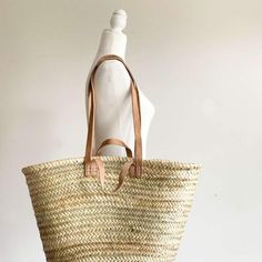 "This bag is handwoven in the souks of Morocco, from a palm leaf. It is a \"Slow Fashion\" product representing everything that is eco, ethical and green. Even though this Spring & Summer season is all about straw. Small round wicker French basket, hand woven in Marrakech by friends and family. Ideal small shopper or beach bag. Also a perfect bag or gift for a girl - great for school books etc. This braided bag is perfect anytime and everywhere, Especially in the summer and there are those who l Palm Leaf Bag, Moroccan Bags, French Market Bag, Leaf Bag, French Basket, French Market Basket, Moroccan Basket, Deadpool Art, Braided Bag