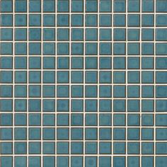 a blue and white tiled wall with small squares on the bottom, in different shades