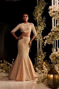 This fish cut lehenga set features intricate pearl, sequin and crystal embroidery on a powder peach net base. The ensemble is paired with a delicately scalloped blouse and an embroidered net dupatta.From Seema Gujral's Tuscan Summer collection. DELIVERY TIMEPlease allow 8-12 weeks for your outfit to arrive. FABRIC DETAILSNet Professional cleaning only. Fish Cut Lehenga, Fish Cut Gown, Diwali Outfit, Engagement Dress For Bride, Fish Cut, Heavy Lehenga, Scalloped Blouse, Character Wardrobe, Indian Wedding Gowns