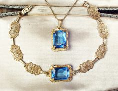 "I am SO thrilled to be offering an exquisite very rare Victorian/Edwardian circa 1930s -1940s era gold plated sapphire blue cut glass crystal pendant necklace AND/OR matching bracelet perfect for the Bride It's tough enough to find these antique filigree pieces anymore but to find pieces that are gold rather than silver, with blue stones, and then as a set is an extremely rare treat! The detailed gold plated ornate embossed pendant features a claw set rich sapphire blue high-quality cut glass c Art Deco Hallmarked Jewelry For Wedding, Art Deco Hallmarked Wedding Jewelry, Gold Art Deco Jewelry For Formal Occasions, Antique Filigree Jewelry For Formal Occasions, Art Deco Filigree Jewelry For Formal Occasions, Formal Art Deco Filigree Jewelry, Vintage Filigree Jewelry For Vintage Events, Antique 14k Gold Jewelry For Wedding, Art Deco Hallmarked Jewelry For Vintage Events