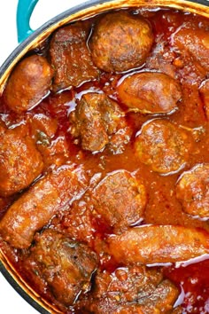 meatballs and sauce in a blue pot