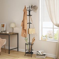 a coat rack in the corner of a room next to a chair and window with curtains