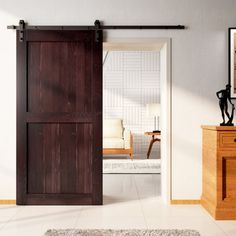 a living room with an open sliding barn door