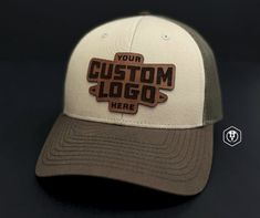 Custom Richardson 115 Trucker Hat with Leather Patch - Personalized Design, Laser Engraved Logo/Text for Branding & Style. Elevate your style and brand presence with our Custom Leather Patch Trucker Hat - Richardson 115. A refined version of the classic 112 Trucker, this hat offers both comfort and a sleek design, making it perfect for both business branding and personal style. PRODUCT DETAILS -------------------------- - Model: Custom Leather Patch Trucker Hat - Richardson 115 - Leather Patch: Custom Trucker Hat With Leather Patch For Outdoor, Glowforge Leather Patch Hat, Leather Trucker Hat With Logo Patch, Trucker Hat With Leather Patch, Six-panel, Adjustable 5-panel Trucker Hat With Leather Patch, Logo Text, Leather Hide, Engraved Logo, Unique Logo