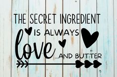 a sign that says the secret ingredient is always love and butter on a wooden background