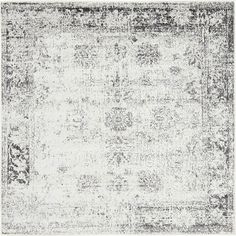 an area rug with grey and white colors