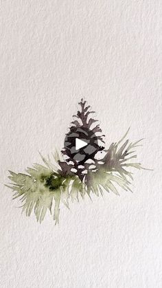 a pine cone sitting on top of a leafy green plant next to a white wall