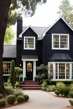 a black house with white trim and windows