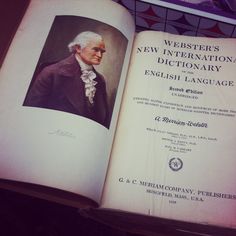 an open book with the title webster's new international dictionary and english language on it