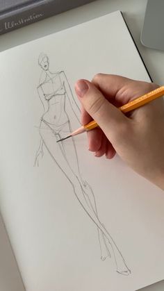 a drawing of a woman's body is shown with a pencil in her hand