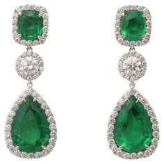 Incredible Green color! Gorgeous emerald and diamond drop earrings. 15 carats of cushion cut and pear shaped emerald drops. 4.31 carats of white round brilliant cut diamonds. Set in 18k white gold. 1.5 inch length. Certified by Christian Dunaigre of Switzerland. The certificate is available on request for serious inquiries. Pictures do not do these emeralds justice! Diamond And Emerald Earrings Studs, Pear Emerald Earrings, Emerald Drop Earrings, Emerald Diamond Earrings, Emerald Earrings Drop, Droplet Earrings, Diamond Earrings Design, Earrings Design, Design Board