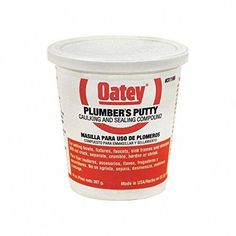 a cup of oatey plumber's putty on a white background