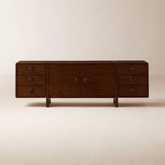 the sideboard is made out of wood and has four drawers on one end, two at the top and three at the bottom