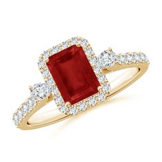 an engagement ring with a red stone surrounded by diamonds