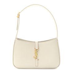 This is an authentic SAINT LAURENT Smooth Calfskin Le 5 A 7 Hobo in Crema Soft. This elegant shoulder bag is crafted of smooth calfskin leather in off-white. The bag features adjustable shoulder strap and a gold prominent YSL monogram cross strap. This opens to a beige suede leather interior with a zipper pocket. White Ysl Bag, Ysl Sling Bag, Saint Laurent Bag, Black Cross Body Bag, Clothing Ideas, Cross Straps, Leather Interior, White Bag, Sling Bag