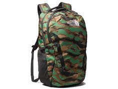 The North Face Vault Backpack - Backpack Bags : Deep Grass Green Painted Camo Print/Asphalt Grey : Locking your performance down, The North Face Vault Backpack features a completely revamped design from the original. With new features such as a floating 15 laptop sleeve, a breathable FlexVent suspension system for added breathability, and an optimized organization system for smaller gear, the Vault daypack secures your commute to school or the office. Adventure daypack made of durable polyester. The North Face Sports Backpack, The North Face Green Backpack For Everyday Use, Green The North Face Backpack For Everyday, The North Face Green Standard Backpack, Green The North Face Backpack For Outdoor Activities, The North Face Green Backpack For Outdoor, The North Face Backpack For Camping, Green The North Face Outdoor Backpack, The North Face Standard Backpack For Camping