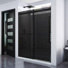 a modern bathroom with black and white decor