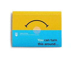 a yellow and blue box with an emoticive face on it's side