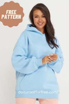 a woman wearing a blue hoodie and pink sweatpants with the words free pattern on it