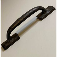 an iron handle on a white table