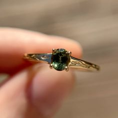 Fae Ring with an olive green Australian sapphire. Hand engraved details on each side. Fae Ring, Australian Sapphire, Ring Inspo, Emerald Rings, Montana Sapphire, Green Sapphire, Wedding Things, Emerald Ring, Hand Engraving