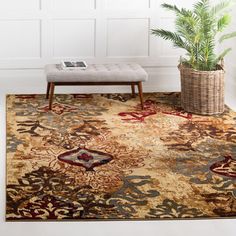 an area rug with a bench and potted plant in the corner next to it