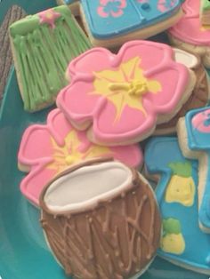 some decorated cookies on a blue plate