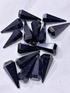 Enhance your collection with these stunning Midnight Blue Goldstone Faceted Points. Each piece is expertly crafted, featuring a deep blue hue interspersed with shimmering flecks that catch the light beautifully.  Size : 50-60 mm  Perfect for jewelry making, crystal healing, or as a decorative accent, these faceted points are a versatile addition to any enthusiast's array. Experience the captivating sparkle and elegant design of Goldstone, a man-made gemstone known for its eye-catching appeal and Blue Goldstone, Purple Crystals, Healing Crystal, Blue Hues, Crystal Items, Deep Blue, Midnight Blue, Bead Charms, Crystal Healing