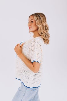 Stay stylish with our On The Boardwalk Top! This crochet knit cardigan features a collar and a vibrant blue lining, perfect for adding a pop of color to any outfit. Comfortable, trendy, and versatile, this top is a must-have for any fashion lover! Details Crochet knit cardigan Collar Blue lining Sizing Approximate measurements: SIZE LENGTH BUST Small 25" 46" Medium 26" 50" Large 27" 52" Fabric has stretchModel is 5’10 wearing small Material 100% Polyester Hand wash coldLay flat to dry Fall Crochet Trim Tops For Day Out, Crochet Top For Day Out In Fall, Cream Crochet Top For Spring Layering, Trendy White Top With Crochet Trim, White Cardigan With Crochet Trim For Fall, Trendy White Tops With Crochet Trim, Chic Cotton Beach Sweater, Spring Blue Open Knit Outerwear, Summer Knit Outerwear For Layering