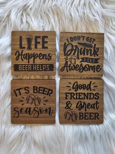 three wooden coasters with different sayings on them sitting on a white furnishing