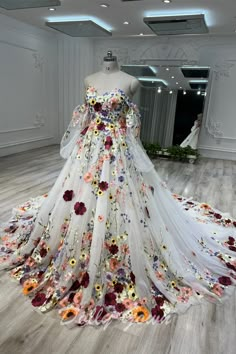 Fairytale Off The Shoulder Long Sleeve Colorful 3D Flowers Ball Gown Wedding Dress Multi Color Wedding Dress, Wedding Dresses Embroidery Flowers, Plus Size Wedding Dresses Colorful, Dress Covered In Flowers, Colorful Bridal Gown, Bright Floral Wedding Dress, White Wedding Dress With Colored Flowers, Colourful Floral Wedding Dress, Red Floral Wedding Dress