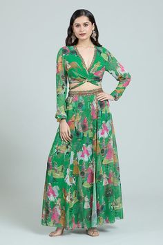 Lush green blouse with midriff cutout, back tie-up, multi colored Mughal art inspired figurine prints and scalloped hand embroidered neckline. Comes with coordinating printed lehenga with attached trouser and hand embroidered waistline. - Aza Fashions Bohemian Green Sets For Spring, Bohemian Green Spring Set, Green Bohemian Maxi Length Sets, Bohemian Green Tops For Party, Green Maxi Length Summer Set, Green Maxi Length Set For Summer, Green Fitted Bohemian Set, Green Floral Print Maxi Set, Green Floral Print Maxi Length Set