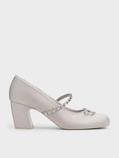 Classic with a twist, these Mary Jane pumps will make a subtle statement without overwhelming your look. Inspired by elegant ballet slippers, this pair features crystal-studded straps across the vamps, alongside dainty knotted bows. The neat, mid-height block heels offer a stature boost without sacrificing comfort. In light grey, they are more eye-catching than black shoes -- yet, they remain versatile enough to pair well with most outfits. Mary Jane Pumps, Ballet Slippers, Charles Keith, The Vamps, Mary Janes, Black Shoes, Block Heels, Light Grey, High Heels