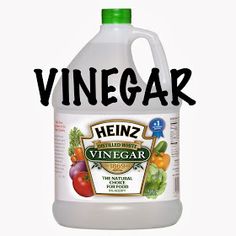 a bottle of vinegar sitting on top of a white background with the words vinegar over it