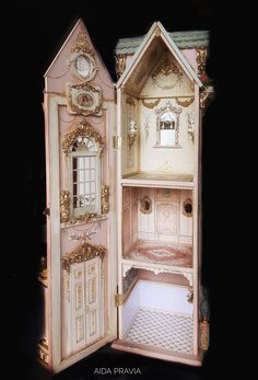 an open doll house with all the furniture in it