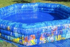 an inflatable swimming pool on the grass