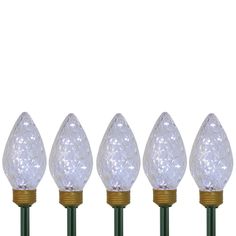 five white christmas lights are lined up in a row