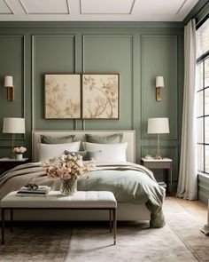 a bedroom with green walls and white bedding