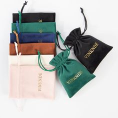 four velvet pouches with the name verandoe printed on them and tied together