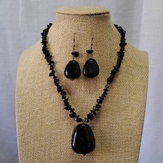 Shiny Black Onyx Chips Are Strung With Seed Beads In This 14" Choker Type Necklace With A Large 1" X 1" Black Stone Hanging From The Center. 1" Chain Extension Gives A Little More Length To This Choker That Is Closed By A Lobster Claw Clasp. Matching Pierced Earrings Are 1 1/4" Long And Have A Large 3/4" X 1/2" Black Stone And Hang From Sterling Silver French Ear Wires. This Choker Necklace Is One You Would Wear With Many Outfits As A Go To Necklace. It's Very Bohemian And Would Look Cute With T Light Blue Necklace, Chip Necklace, Sodalite Necklace, Beaded Pouch, Agate Pendant Necklace, Tigers Eye Necklace, Wood Bead Necklace, Leather Corded Necklace, Turquoise Bead Necklaces